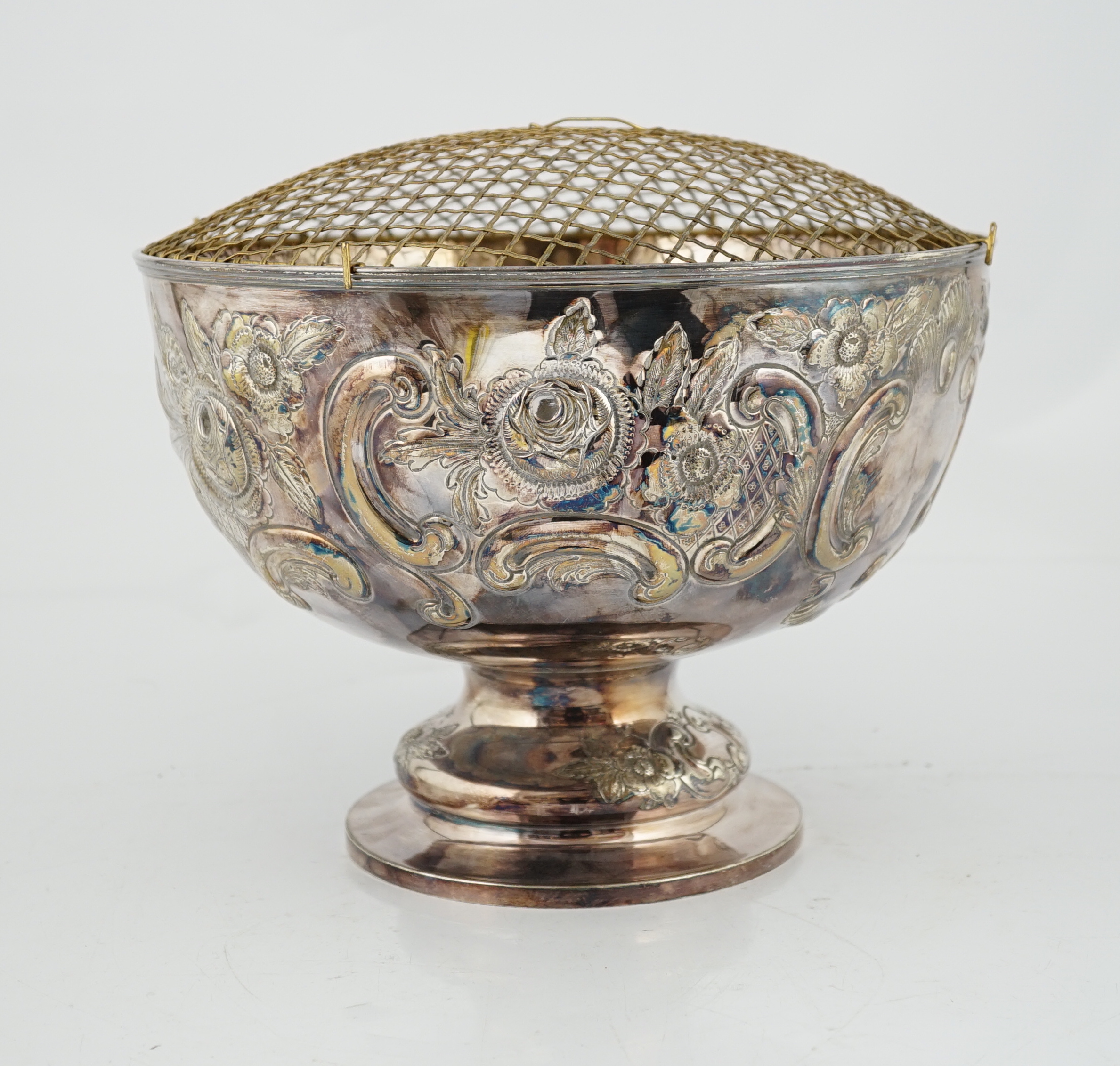 A large Edwardian repousse silver rose bowl, by Carrington & Co